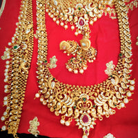 N05005_ Grand classic matte gold polished temple jewelry bridal choker+ long necklace + hipbelt+earrings & maangtika style crafted gold plated necklace set embellished with stones .