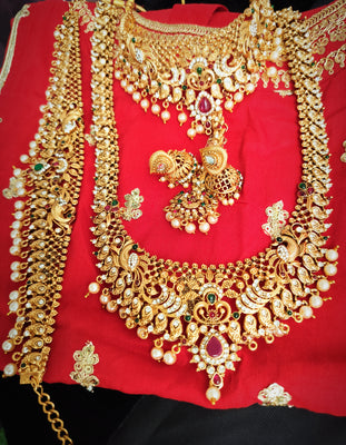 N05005_ Grand classic matte gold polished temple jewelry bridal choker+ long necklace + hipbelt+earrings & maangtika style crafted gold plated necklace set embellished with stones .