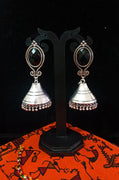 Silver oxidized earrings in Jumki pattern and exclusive silver work with black stone for a stunning and stylish look.