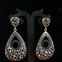 Silver oxidized earrings with never seen pattern and exclusive silver work with black stone for a stunning and stylish look.