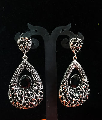 Silver oxidized earrings with never seen pattern and exclusive silver work with black stone for a stunning and stylish look.