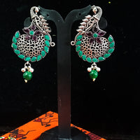 Silver oxidized earrings with green ruby studded and exclusive silver work for a stunning and stylish look.