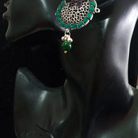 Silver oxidized earrings with green ruby studded and exclusive silver work for a stunning and stylish look.