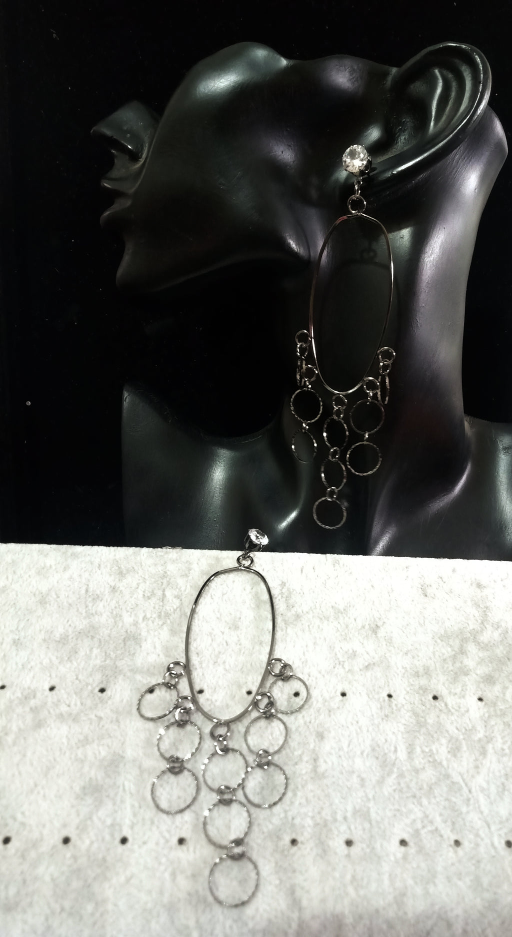 Stand-out dangler with beautiful black metal design.