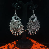 Silver oxidized earrings with exclusive silver peacock  work for a stunning and stylish look.