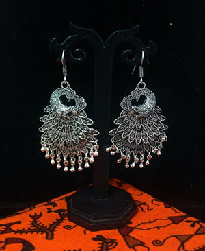 Silver oxidized earrings with exclusive silver peacock  work for a stunning and stylish look.