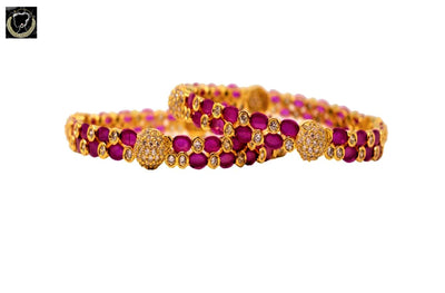 B024_Gorgeous 1 gm Gold plated bangles studded with pink stones and American Diamond stones.