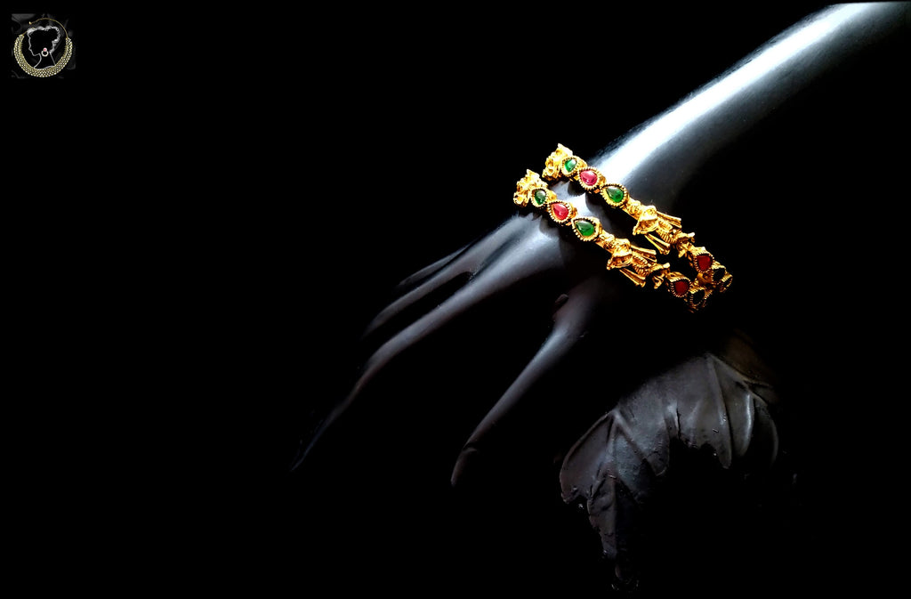 B040_Classic Gold plated krishna embossed bangles studded with pink and green stones.