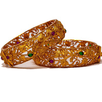 B045_Gorgeous Matte Gold  plated bangles studded with pink and green ruby stones.