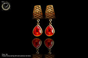 E036_Classy golden colored beautifully crafted earring with delicate work of red stone