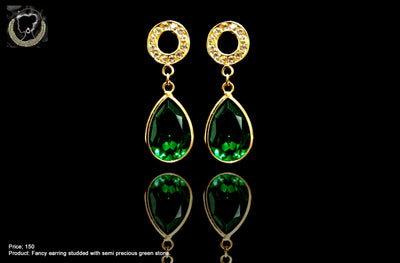 E037_Classy golden colored crafted earring with delicate work of green stone