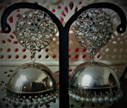 E0116_ Glamorous Base Metal jumkas studded with premium stones with a touch of pearls.