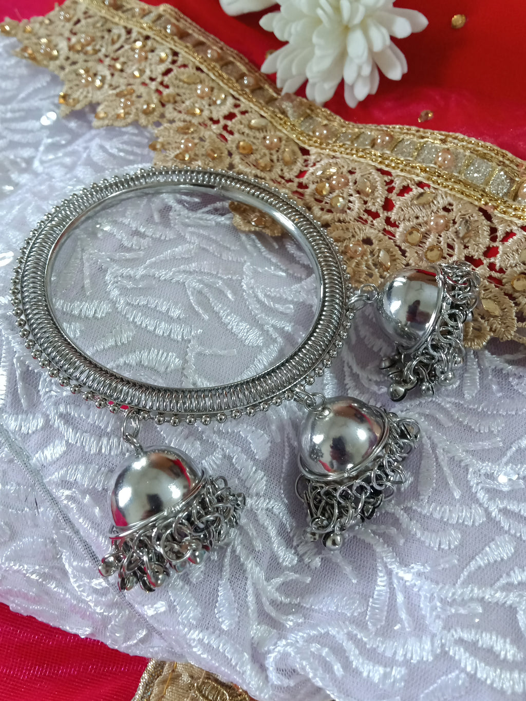 B0151_ Glossy fine polish Sparkling silver color metal bangles along with jumka drops with a touch of beads.