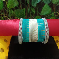 B0150_Exquisite bangles set with colorful metal bangles along with American Diamond bangles.