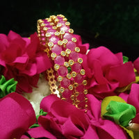 B0163_Elegant Golden crafted bangles studded with pink ruby stones with a touch of American Diamond stones.