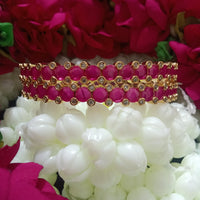 B0163_Elegant Golden crafted bangles studded with pink ruby stones with a touch of American Diamond stones.