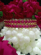 B0163_Elegant Golden crafted bangles studded with pink ruby stones with a touch of American Diamond stones.