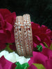 B0152_S_ Exquisite Rose Gold plated bangles with delicate art work studded with  American Diamond stones.