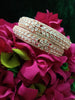 B0152_S_ Exquisite Rose Gold plated bangles with delicate art work studded with  American Diamond stones.