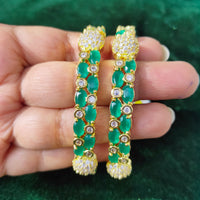 B0176_Gorgeous golden bangles embellished with American Diamond stones with a touch of green stones.