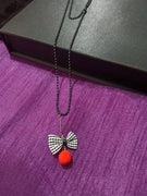 N0279_Trendy bead necklace with bow tie fabric pendant with a touch of beads.