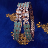B0216_Lovely designed bangles with delicate stone work with a touch of ocean green stones.