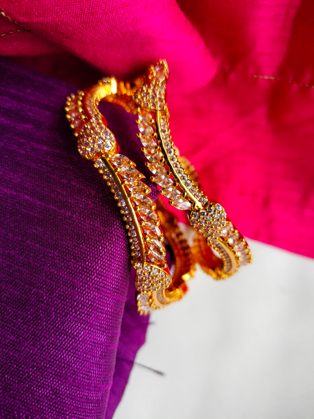 B0267_Lovely designer Gold plated bangles studded with  American Diamond  stones with delicate stone work.