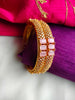 B0272_Classic Gold plated bangles studded American Diamond  stones with a touch of pink stones.