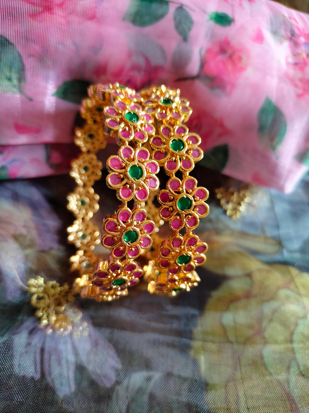 B0288_Beautiful flower design golden bangles with delicate craftwork with a touch of ruby stones.