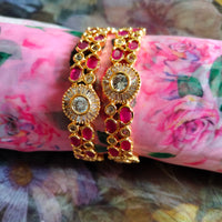 B0289_Beautiful golden bangles with delicate craftwork with a touch of ruby stones.