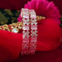 B0294_Lovely floral design rose gold Bangles studded with American Diamond stones with delicate stone work.