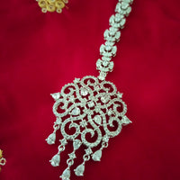 M027_Classic designer rhodium plated American diamond studded Maang tika with delicate stone work.