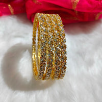 B062_Gorgeous Gold plated bangles studded with  American Diamond stones.