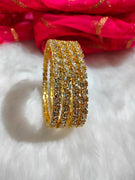 B062_Gorgeous Gold plated bangles studded with  American Diamond stones.