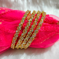 B062_Gorgeous Gold plated bangles studded with  American Diamond stones.