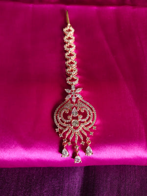 M032_Elegant designer rose gold American diamond studded Maang tika with delicate stone work.