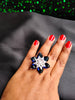 R069_Elegant flower design American Diamond studded statement ring with a touch of navy blue  stones.