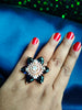 R063_Gorgeous flower design American Diamond studded statement ring studded with navy blue colour stones.