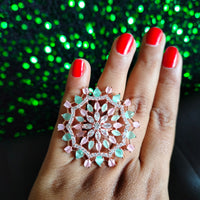 R082_Classic Grand circular design rose gold American Diamond studded statement ring with a touch of green & pink  stones.