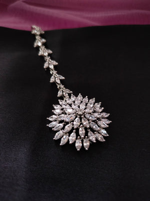 M033_Elegant circular floral design American diamond studded Maang tika with delicate stone work.