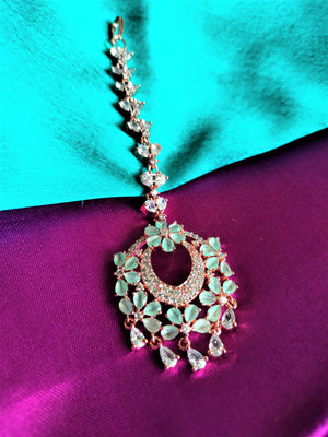 M043_Lovely flower design American diamond studded Maang tika with a touch of sea green  stones.