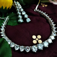 N01176_Grand Lovely designer Silver polished Necklace Set  embellished with American diamond stones with delicate white Stones .