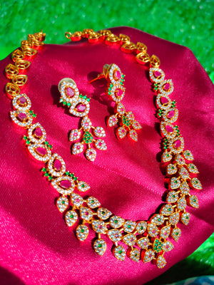 N0563_Classic matte gold polished temple jewelry style crafted design gold plated necklace set embellished with ruby and green stones .