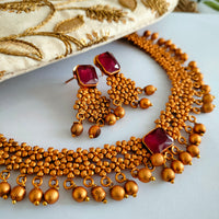 N03018_Classic matte gold polished temple jewelry style  crafted design gold plated necklace set embellished with ruby stones .