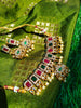 N03025_ classic matte gold polished temple jewelry choker style crafted design gold plated necklace set embellished with ruby and green stones .