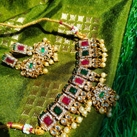 N03025_ classic matte gold polished temple jewelry choker style crafted design gold plated necklace set embellished with ruby and green stones .