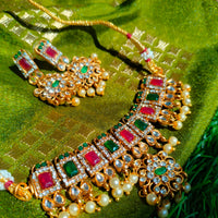 N03025_ classic matte gold polished temple jewelry choker style crafted design gold plated necklace set embellished with ruby and green stones .