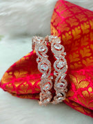 B02008_ Exquisite Rose Gold plated bangles with delicate art work studded with  American Diamond stones.
