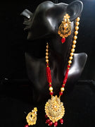 Pleasing and graceful Jaipur necklace laden with exquisite work of red & off white pearls and red crystal