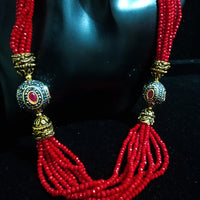 Pleasing and graceful necklace laden with exquisite work of red crystals, beautiful pearls and kundan